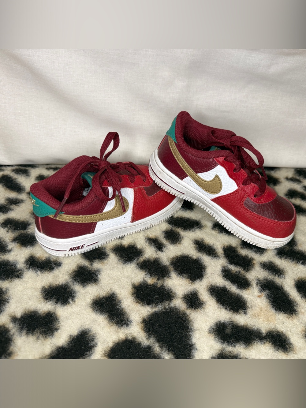 Nike Red, White & Gold Low Top Kids Sneakers with Teal Accent